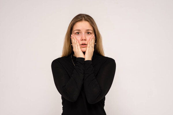 Beautiful girl in different poses shows different emotions on different backgrounds in different clothes