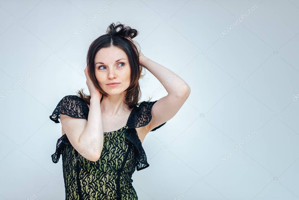 beautiful girl on a white background admires a surprised on a white background