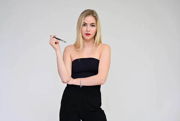 Business training concept with a girl secretary. Portrait of a fashionable beautiful blonde model with long hair, great makeup, on a white background. — ストック写真