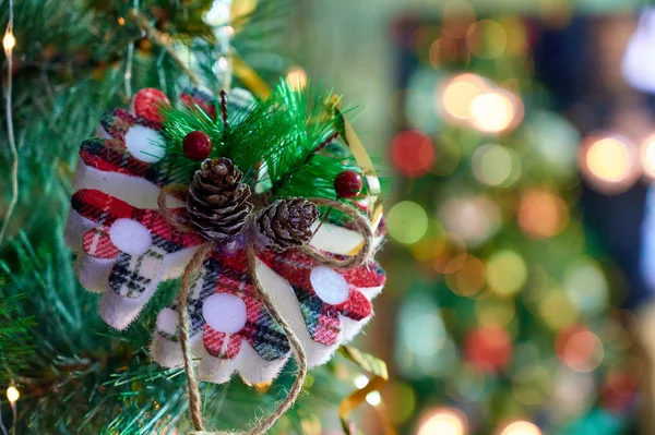 New Year and Christmas concept. Festive photo of decorations for the Christmas tree in the New Year holiday on a background of lights — Stock Photo, Image