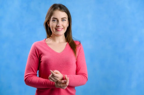 Vertical Portrait Blue Background Pretty Girl Pink Sweater Model Smiles — Stock Photo, Image