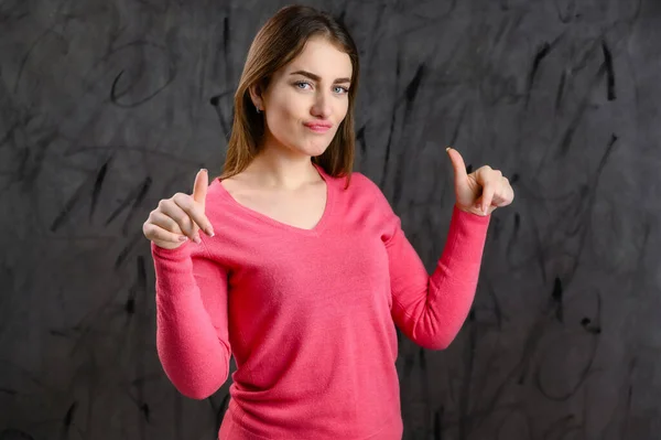 Portrait Gray Background Pretty Woman Pink Sweater Showing Discontent — Stock Photo, Image