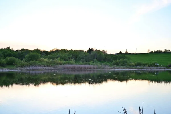 Photo of a lake in a sunny sunset. The concept of heavenly tranquility.