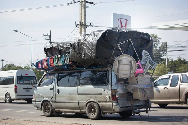 Stock photo of Typical rural transport, overloaded van with people,  Maharashtra, India. Available for sale on