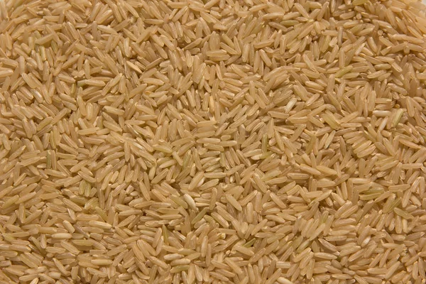 Tahıl kahverengi pirinç arka plan — Stok fotoğraf