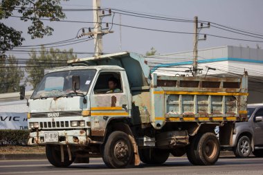 Chiangmai, Thailand - January 9 2020: Private Isuzu Dump Truck. On road no.1001 8 km from Chiangmai Business Area.