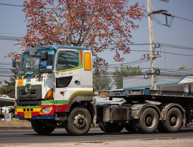 Chiangmai, Thailand - February 7 2020:  Hino  Cargo Truck of WeeRadej Transport. Photo at road no.1001 about 8 km from downtown Chiangmai, thailand.
