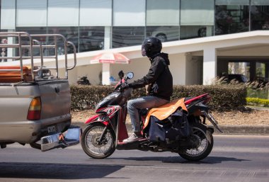 Chiangmai, Thailand - February 13 2020: Shopee Express and Logistics Mini Container Motorcycle. Photo at road no 121 about 8 km from downtown Chiangmai, thailand.