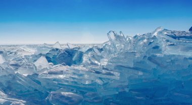 View on and through ice on frozen fields of Lake Baikal clipart