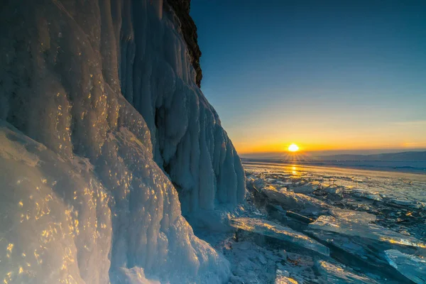 View from the grotto during sunset on the frozen Lake Baikal — Stock Photo, Image