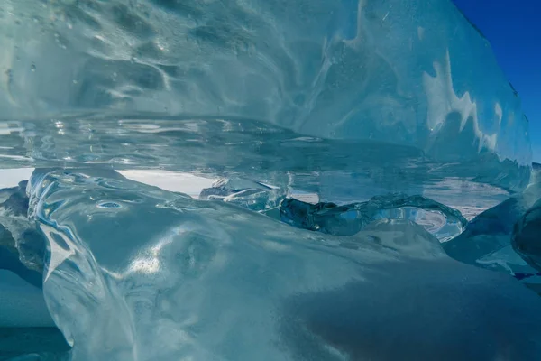 View on and through ice on frozen fields of Lake Baikal — Stock Photo, Image