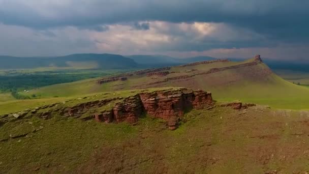 Aerial view of the mountain range Sunduki, green fields sky before the storm in the Republic of Khakassia. Russia — Stock Video