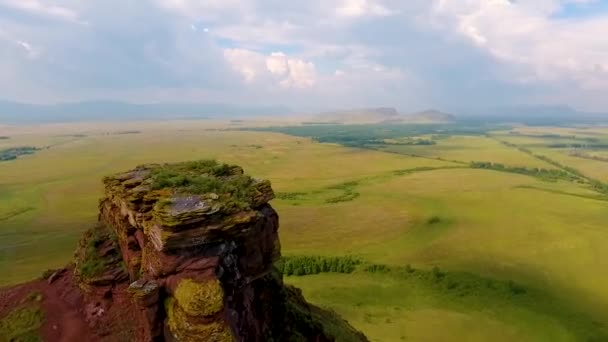 Aerial view of the mountain range Sunduki, green fields sky before the storm in the Republic of Khakassia. Russia — Stock Video