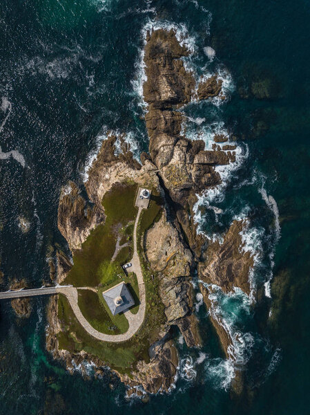 Aerial view of the lighthouse on Pancha island. Northern Spain in summer