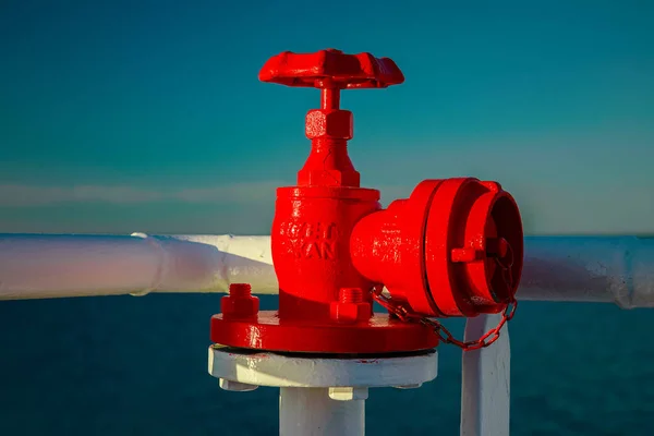 Red fire cock, fireplug on a ship Royalty Free Stock Photos