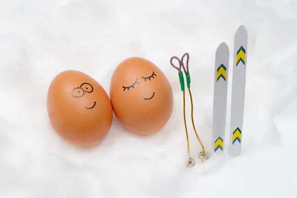 Funny lovely eggs with ski in snow