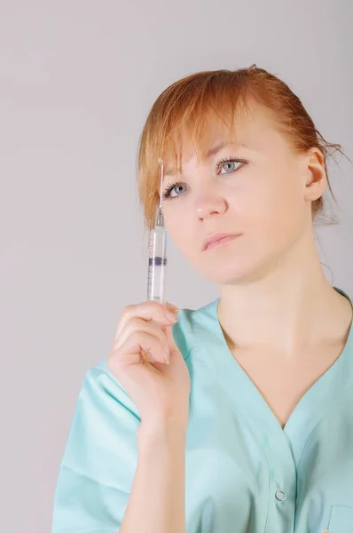 Woman doctor or nurse with syringe — Stock Photo, Image