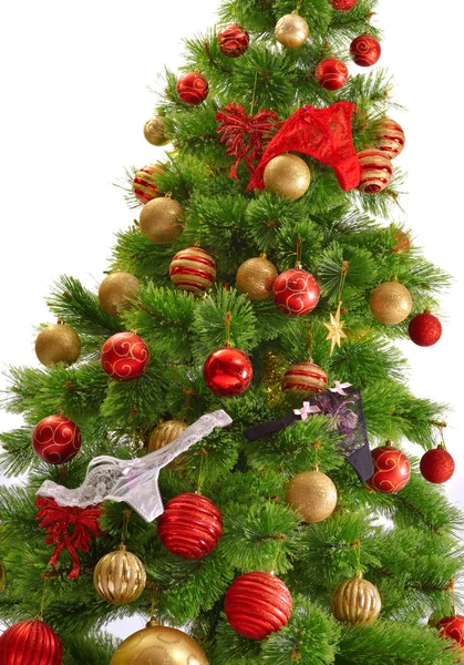 Alegre toma de estudio de un árbol de Navidad con adornos coloridos, aislado en blanco — Foto de Stock