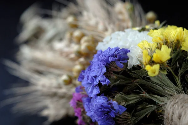 Bouquet of dried flowers and ears of wheat