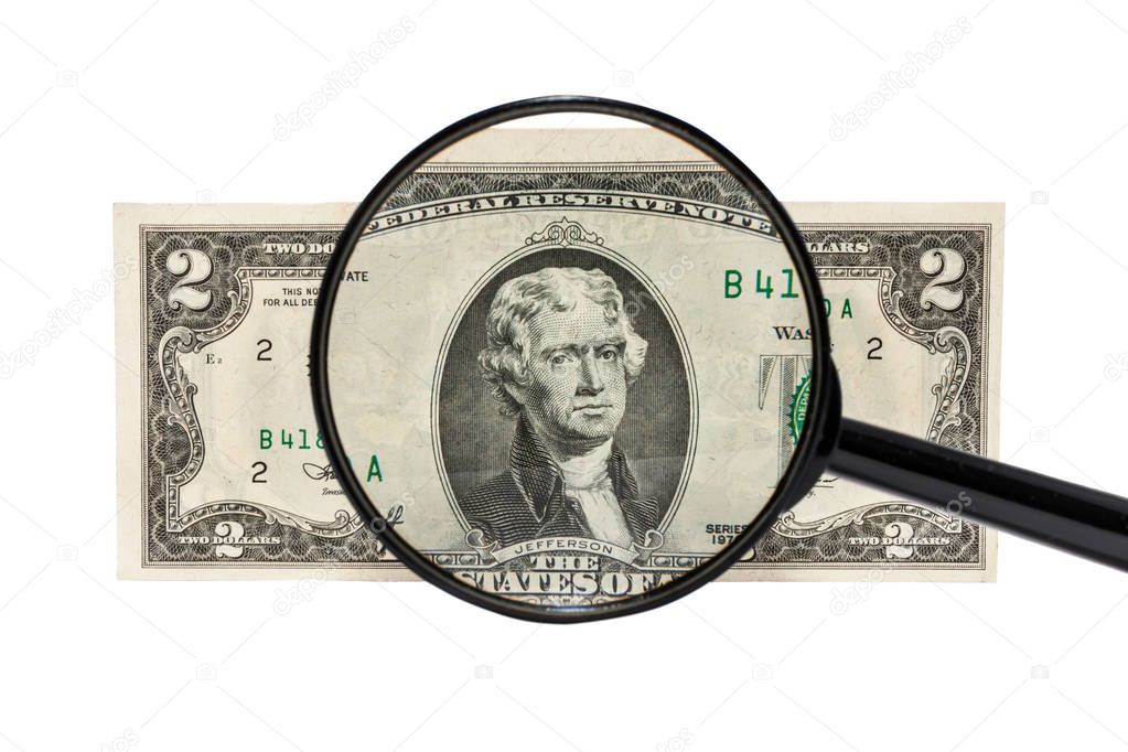 two dollars under a magnifying glass
