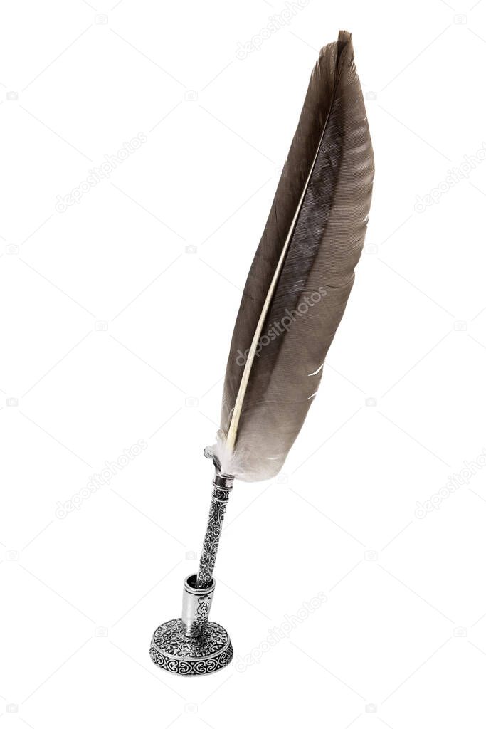 quill pen for writing in a silver frame in a silver inkwell holder isolated on a white background