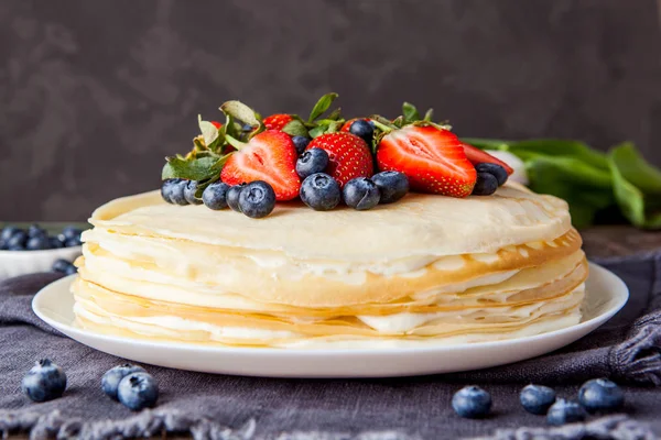 Crepes cake with cottage cheese and strawberry, selective focus