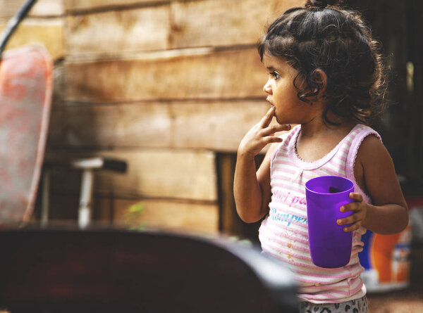 Cute little Mexican girl.Childhood. Portrait of young girl, Mexican ethnicity, outside.