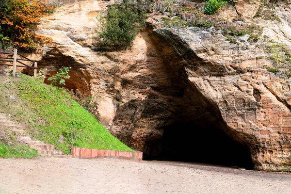 The widest and highest cave in the Baltic countries known as Gutman's Cave, which is located on the Gauja River in the National Park of Sigulda, Latvia.