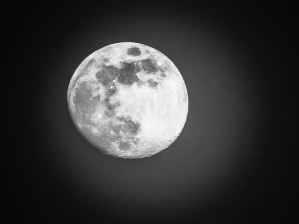 Edited version of the full moon with black sky in the background.