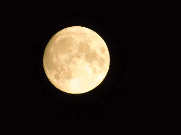 Edited version of the full moon with black sky in the background.