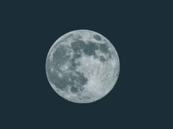 Edited version of the full moon with black sky in the background.