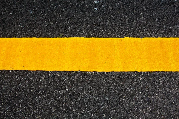 Yellow line on the road texture background — Stock Photo, Image