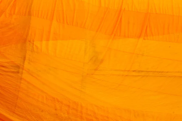 Tissu jaune texture fond. Des robes. Symbole du bouddhisme . — Photo