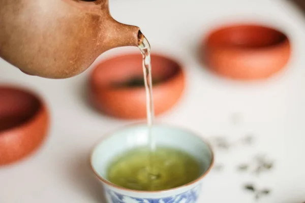 Close Teapot Pouring Green Tea Cup — Stock Photo, Image