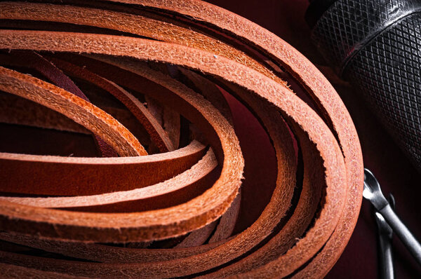 close up of brown leather belts