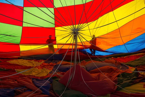 Men gathering the balloon after landing in Cappadocia, Turkey