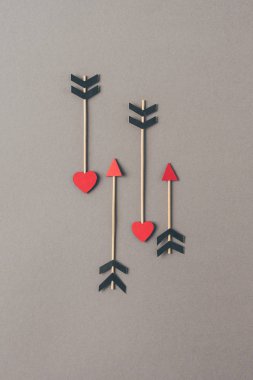 top view of four arrows on gray surface, valentines day concept clipart