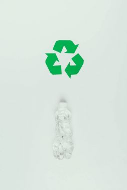 top view of recycle sign and plastic bottle isolated on grey clipart