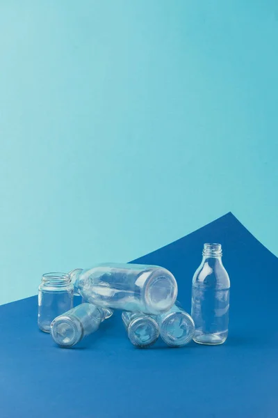 Close View Various Glass Bottles Jars Blue Background Recycle Concept — Stock Photo, Image