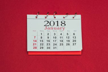 close up view of 2018 calendar isolated on red clipart