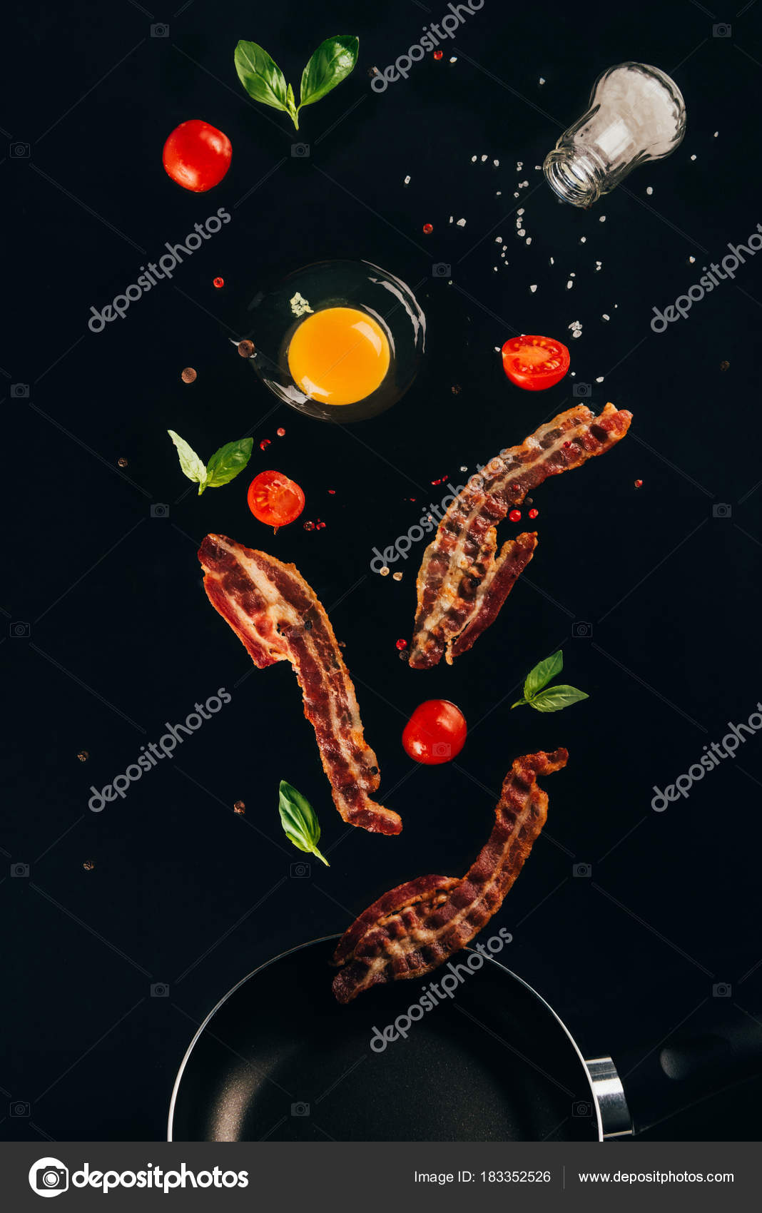 Close View Pieces Bacon Cherry Tomatoes Raw Egg Yolk Falling Stock