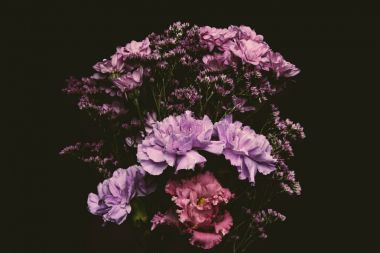 close-up view of beautiful tender pink and purple flowers isolated on black  clipart