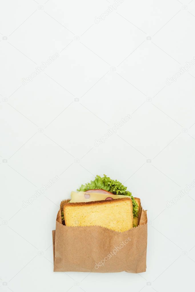 top view of sandwich in paper bag isolated on white