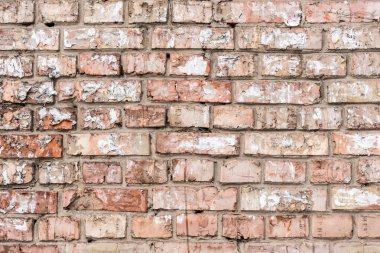 Old wall with broken bricks background clipart