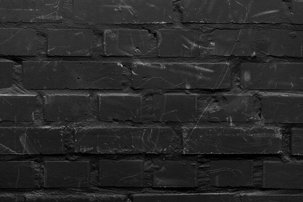 Brick wall painted in black color