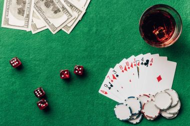 Gambling concept with with cards and dice on casino table  clipart