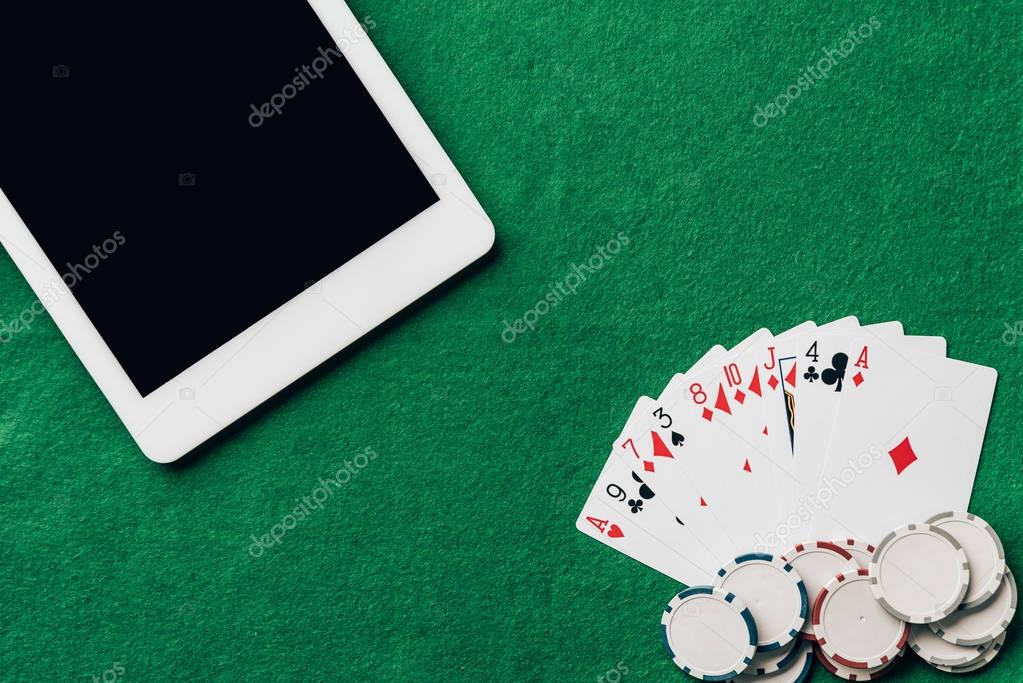 Online gambling with playing cards and chips by digital tablet
