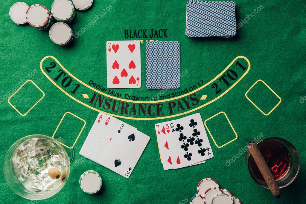Gambling concept with cards and chips on casino table