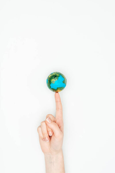 cropped image of woman touching earth model isolated on white, earth day concept