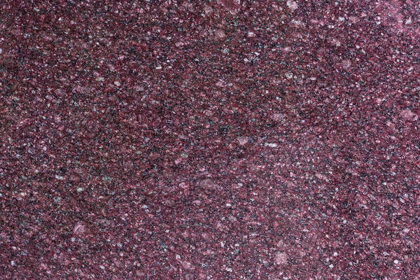 Dark surface of old granite wall